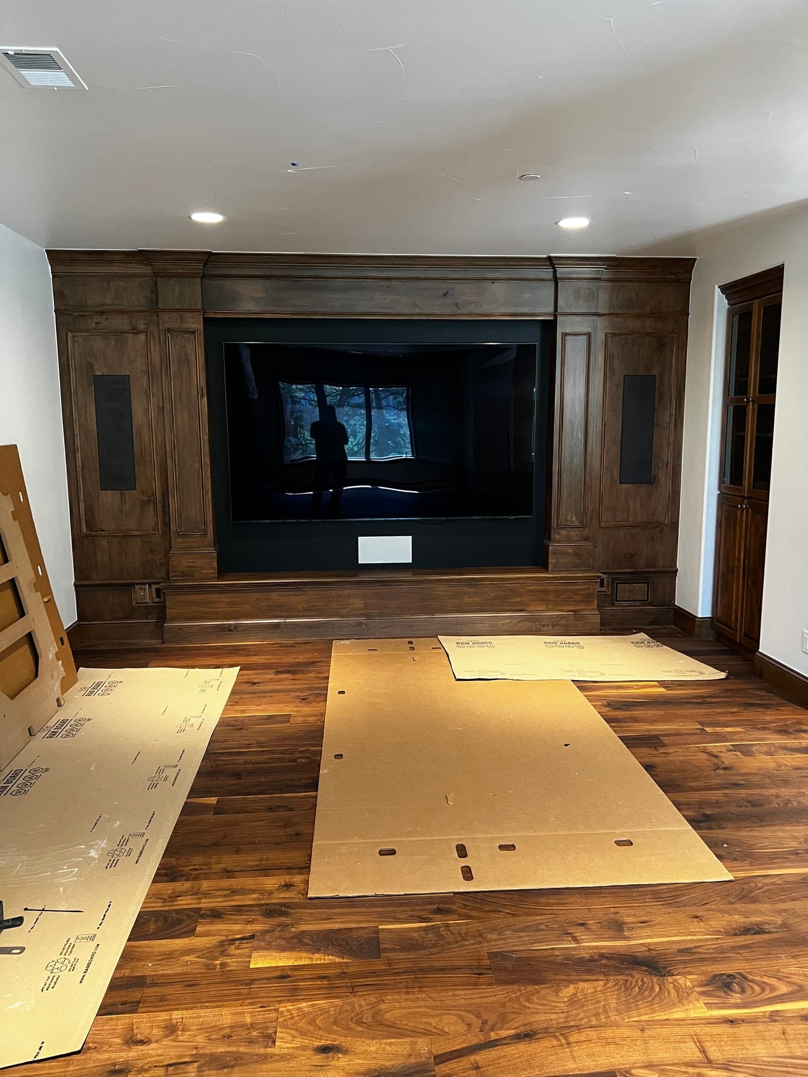 Walnut media wall · staining & finishing — after